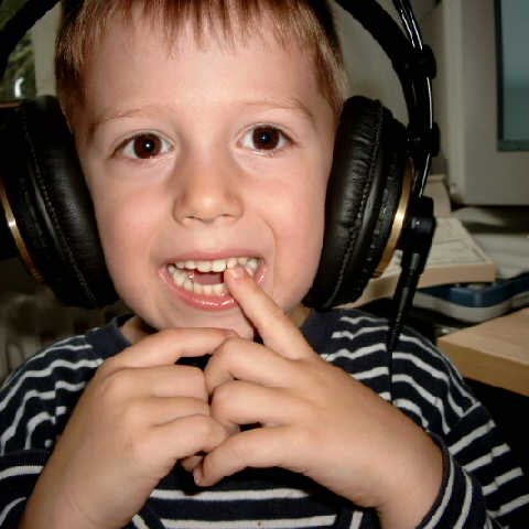 Emanuel as a child, wearing studio headphones